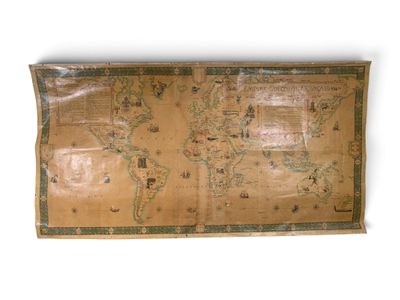 an old map of the world is displayed on a wall