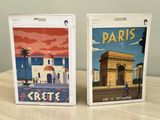 two cards that are sitting on a table