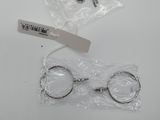 a pair of scissors sitting on top of a plastic bag