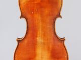 an old violin with a wooden back and bow on a white background