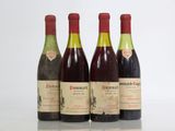 three bottles of wine are lined up in a row on a table