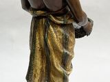 bronze statue of a man with a dog on a white background