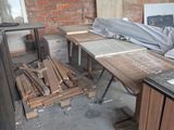 many pieces of wood on the floor in this room