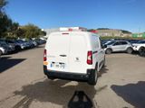 a white van that is parked in a parking lot