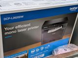 a black and white photo of a printer in a box