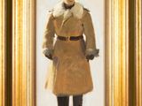 tableau représentant un homme en manteau et chapeau, dans un cadre doré
