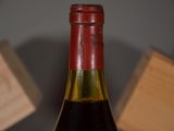 a bottle of wine that is sitting on a table