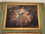 a painting on the wall of a room with a painting of a woman and a man