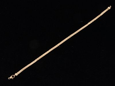 a gold chain with a clasp on a black background