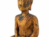 statue of a person sitting in a meditation position on a white background