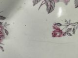 a close up of a plate with flowers on it