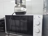 a microwave sitting on top of a counter in a kitchen