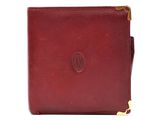 a red leather wallet with a gold clasp on the front