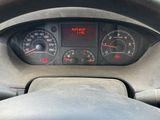 dashboard of a car with a steering wheel and dashboard gauges