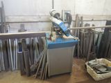 a machine that is sitting in a room with many pieces of metal