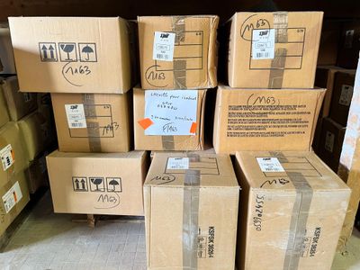 several boxes are stacked on top of each other in a warehouse