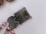 a picture of a bracelet with a clasp and beads on it