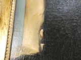 un tableau représentant un homme barbu coiffé d'un chapeau