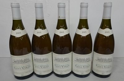 six bottles of wine are lined up on a table