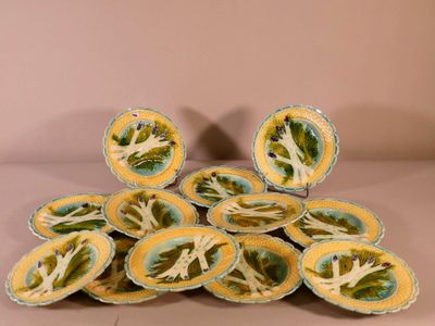 a pile of yellow and blue plates with flowers on them