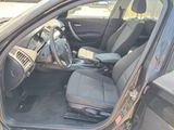 the interior of a car with the door open and the driver ' s seat down