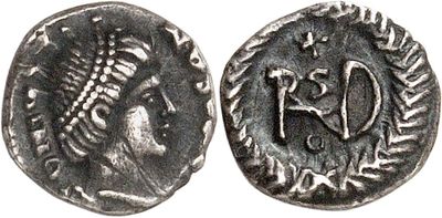 a silver coin with an image of a man on it