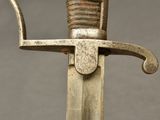 a close up of a sword with a metal handle