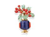an image of a broochle with a plant in it