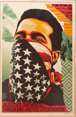 a framed poster of a man with a bandana on his face