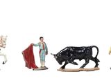 five figurines of people riding horses and a bull