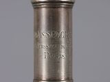an antique silver plated wine bottle with a glass stopper on it