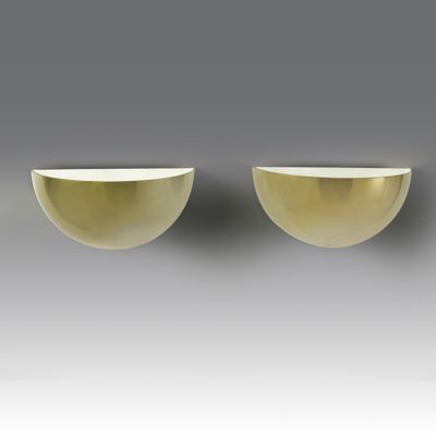two white bowls sitting on top of a table next to each other