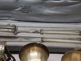 silverware in a silver case on a table