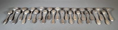 many spoons and forks laid out on the table