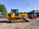 a yellow bulldozer that is parked in the dirt