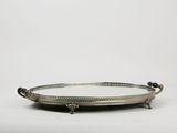 a silver tray with a handle and handles on a white background