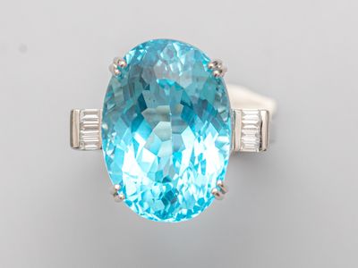 an oval blue topaze and diamond ring