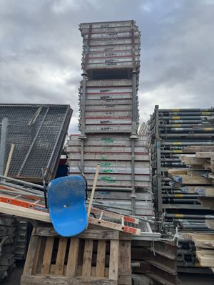 a pile of pallets and a snowboard on the ground