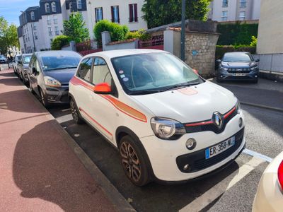 many cars parked on the side of the street