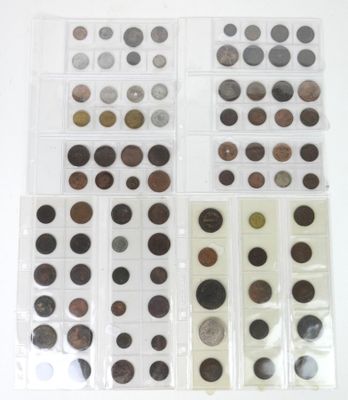 many different types of coins in this display case