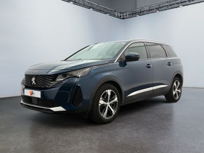 the new peugeot suv is parked in a large room