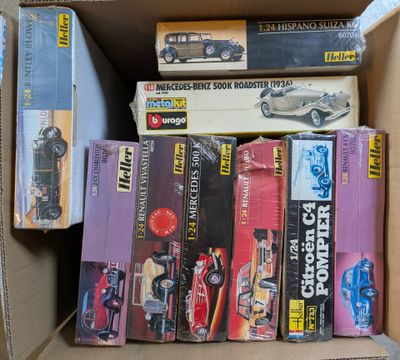 many books in a box that are stacked on top of each other