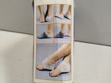 a box that has a picture of a woman ' s feet on it
