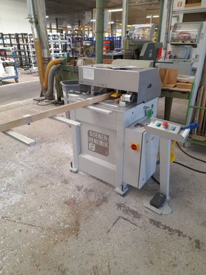 an image of a machine that is cutting wood