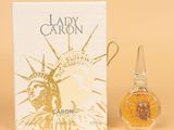 an image of a bottle of lady caron perfume next to a box