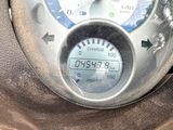 a close up of a meter on a car ' s dashboard