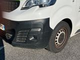 a white van that is parked in a parking lot