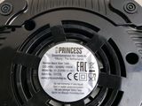 a close up of a black speaker on a table