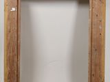 an old wooden picture frame with a hole in the middle of it