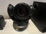 a camera sitting on top of a desk next to a keyboard